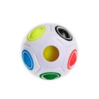 White puzzle ball with colorful circular holes and matching colored slots.
