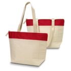 Two cream-colored tote bags with red accents and zipper closures.