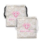 Two drawstring pouches with JEWELRY text and heart designs on a patterned background.