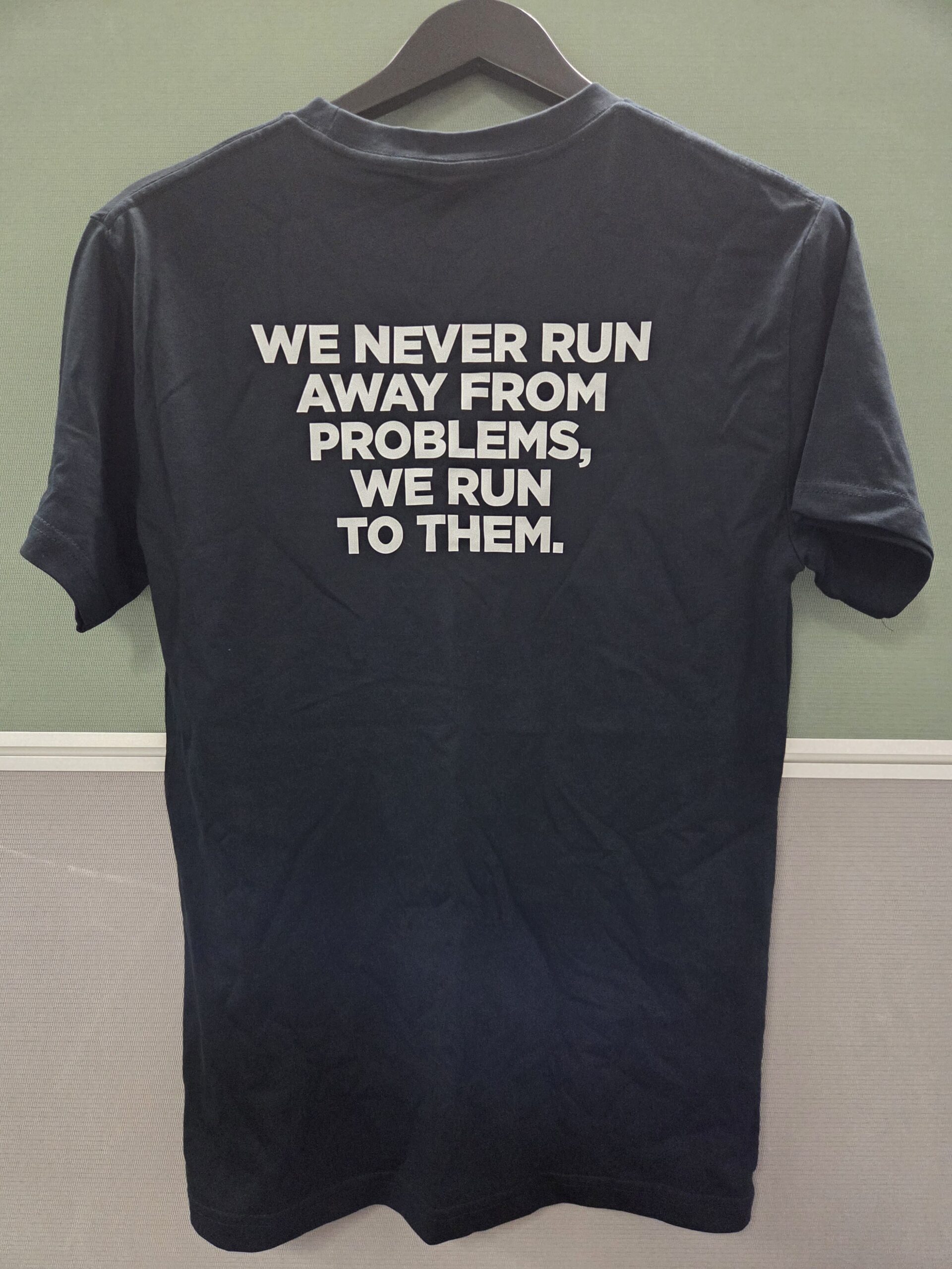 Navy blue t-shirt with bold text, screen printed for a crisp finish that lasts.