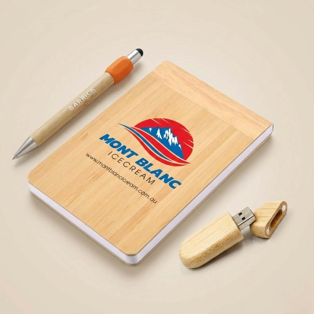 Wooden pen, notepad, and USB drive highlight bamboo vs plastic promotional items debate.