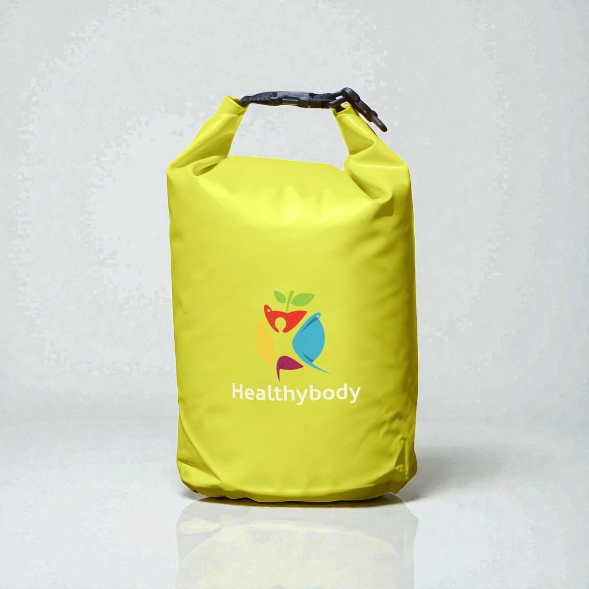 A yellow dry bag, an unusual promo product, with the Healthybody logo and colorful figures.