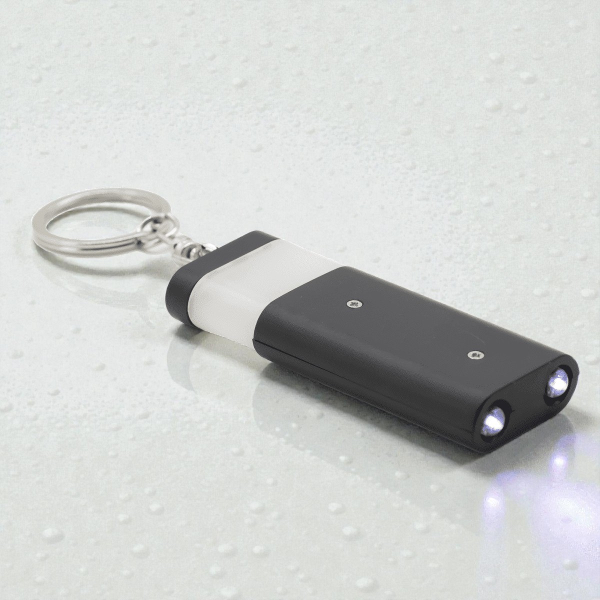Black keychain flashlight with two LED lights—a unique pick for unusual promo products.