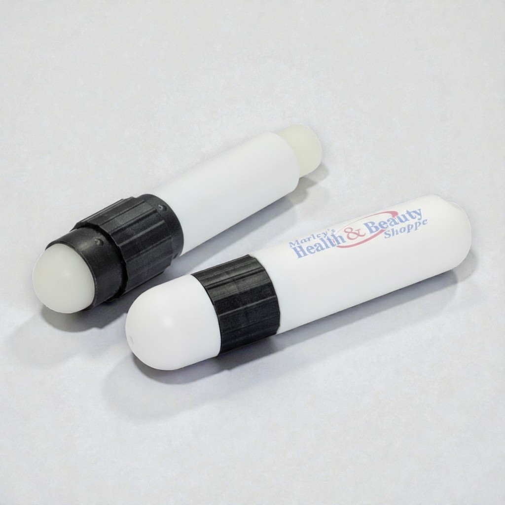 Two white lip balms with black caps, one featuring the health & beauty shoppe logo.
