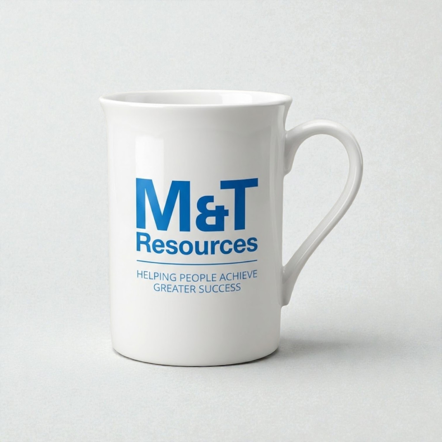 White mug, perfect for real estate welcome packs, with M&T Resources and success message in blue.