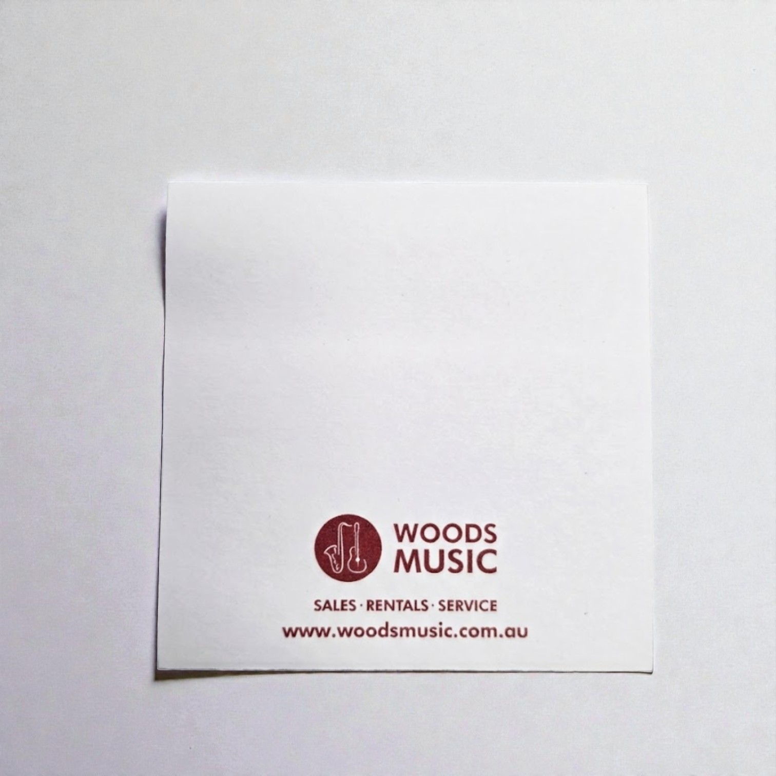 White paper with WOODS MUSIC logo—ideal for real estate welcome packs or client materials.