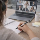 Taking notes with a Muxi Fashion Stylus Pen during a video call, notebook and coffee nearby.