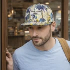 Man in a Chrysler Custom Flat Peak Cap with your logo, standing by a window.
