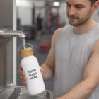 Man filling a Yerri Stainless Steel Bottles 800Ml with YOUR LOGO HERE at gym water fountain.