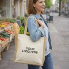 Woman with Bonifay 15L Cotton Tote, “Your Logo Here,” carrying groceries on a city street.