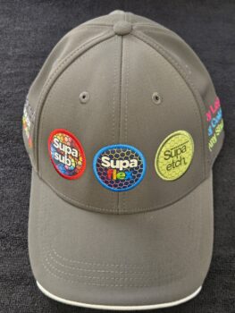 Gray cap with three colorful patches, showcasing the best logo format for your brand.