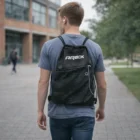 Outdoors with a Student Backsack With Earbud Hole, enjoying music on the go.