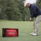 Man putting on green with Taylormade Burner golf balls branded YOUR LOGO HERE.