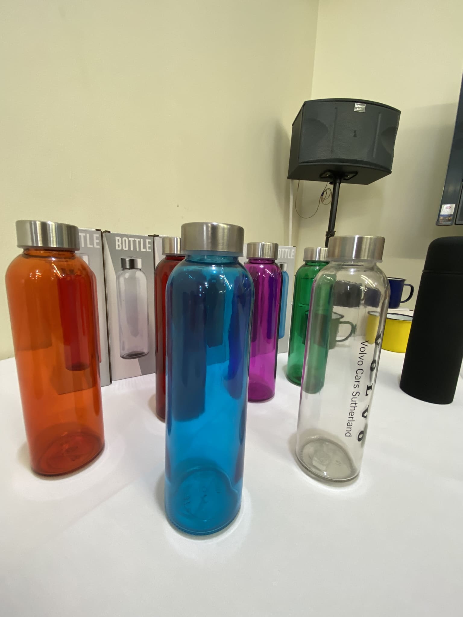 Colorful water bottles with metal lids, part of the latest branded merchandise forecast.