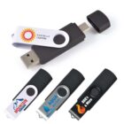 Four USB flash drives with different logos and designs, shown with and without their caps.
