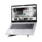 Laptop on a stand with a website displaying a bag on its screen.