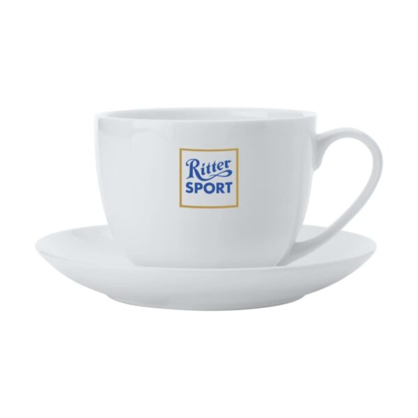 White cup and saucer with the Ritter Sport logo printed on the front of the cup.