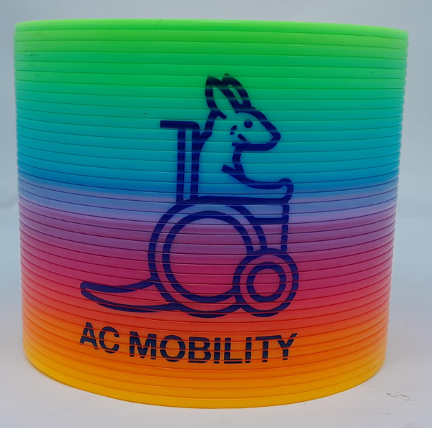 Rainbow spring toy with a kangaroo in a wheelchair, PAFA and AC MOBILITY on it.