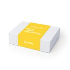 A white gift box with a yellow band that says, just a little something... for you.