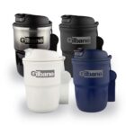 Four reusable coffee mugs in black, white, silver, and navy, each labeled Gilbane.