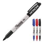 Four Sharpie markers in black, blue, and red with HITACHI on the black marker cap.