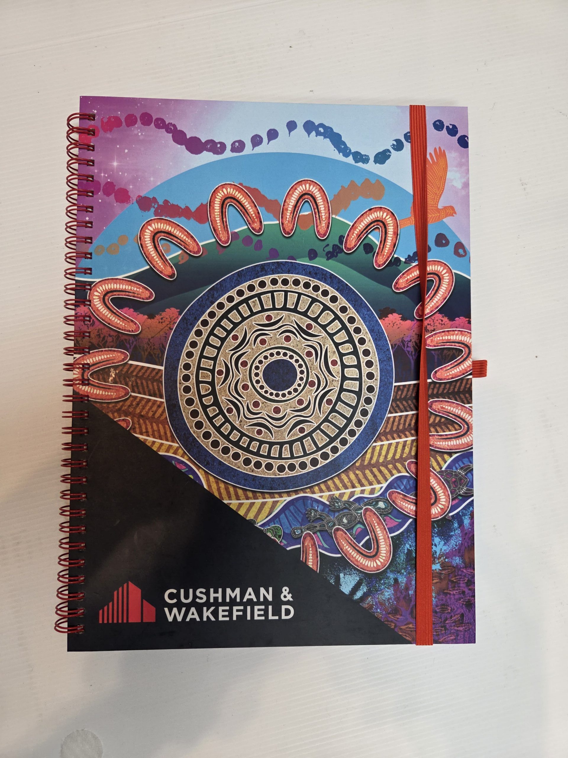 A colorful spiral-bound calendar—perfect for event planning or as unique event gift ideas.