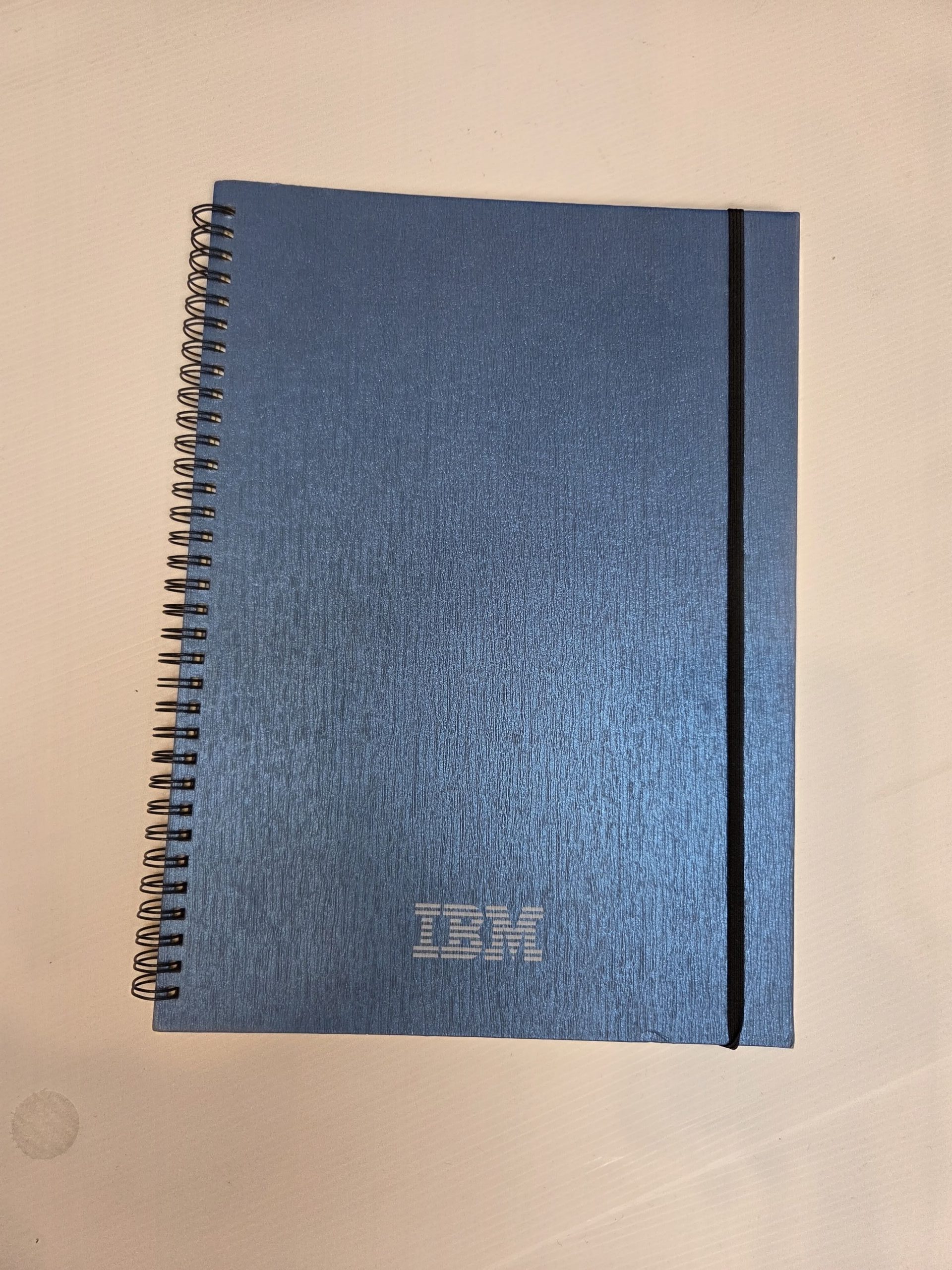 Blue spiral notebook with IBM logo, perfect as one of 5 items for events giveaways.