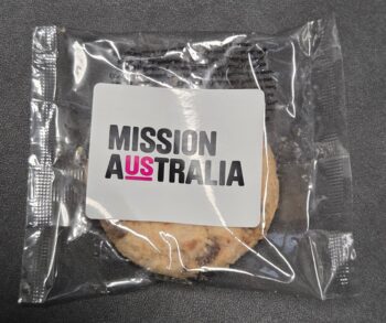 A packaged cookie labeled MISSION AUSTRALIA with US in pink; compare similar products.