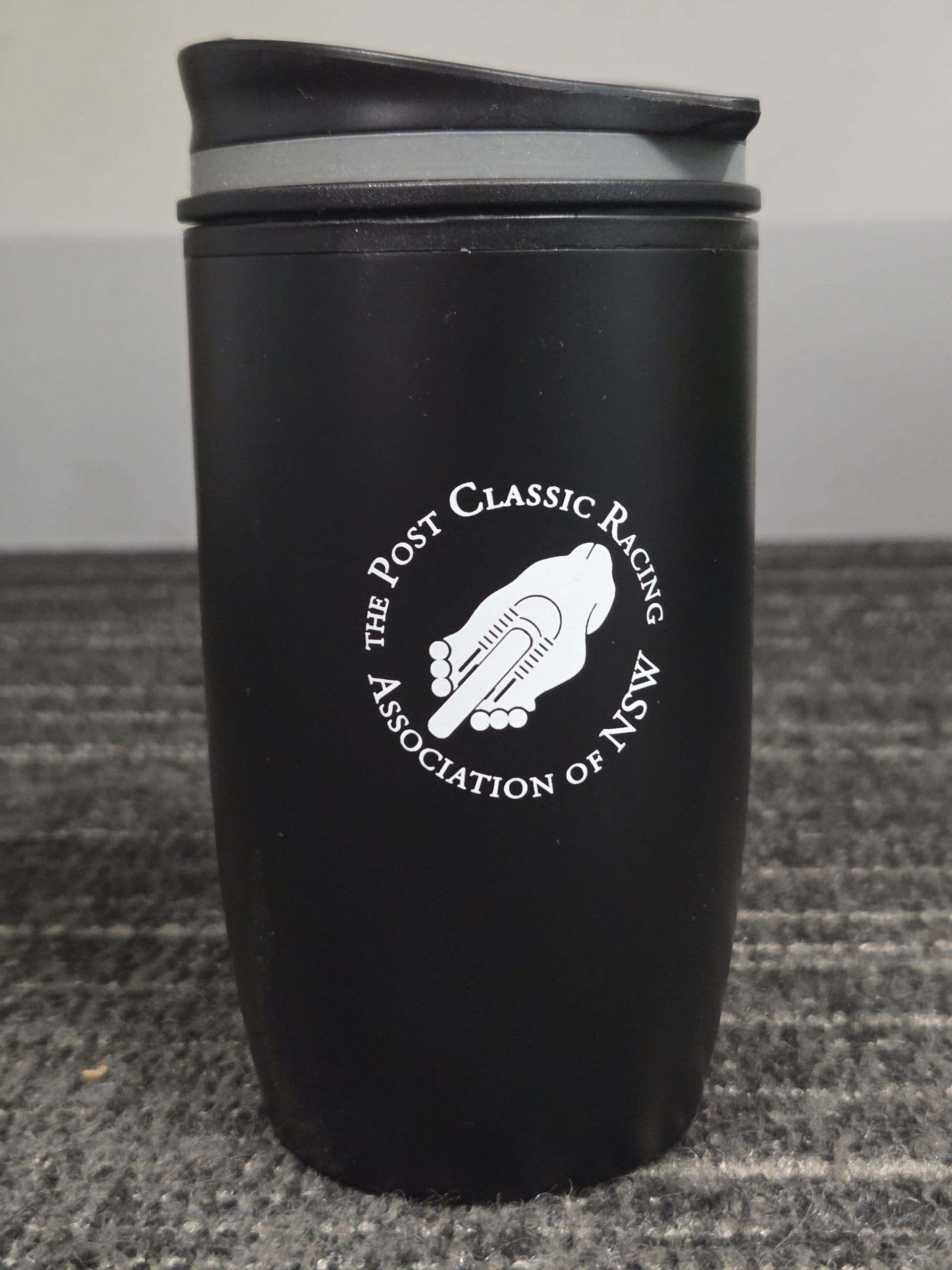 Black travel mug, ideal as 1 of 5 items for events, with MSN Post Classic Racing Association logo.