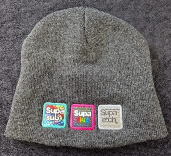 Gray knit beanie with three colorful patches, ideal for product comparison or advising clients.
