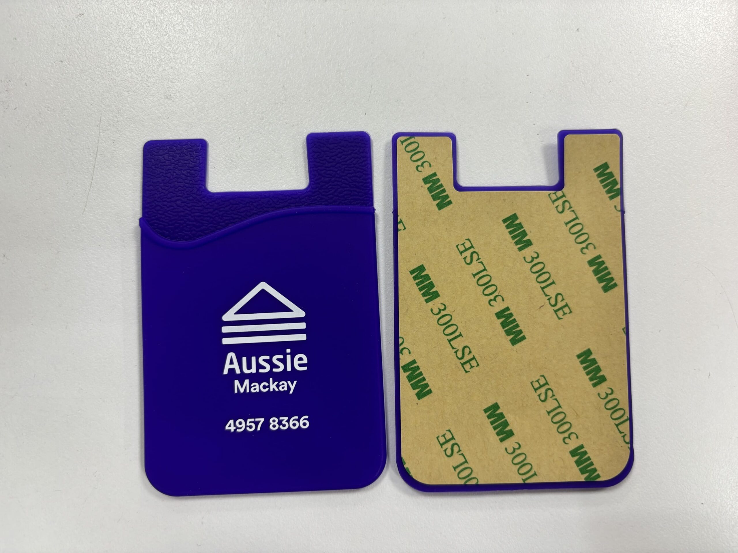 Two blue phone card holders, great as 5 items for events, show text/logo and adhesive backing.