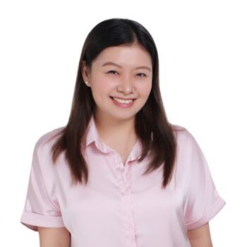 Meet the team: Woman with straight dark hair in a light pink blouse smiles at the camera.