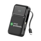 Black Intuit QuickBooks power bank with digital display and attached charging cable.