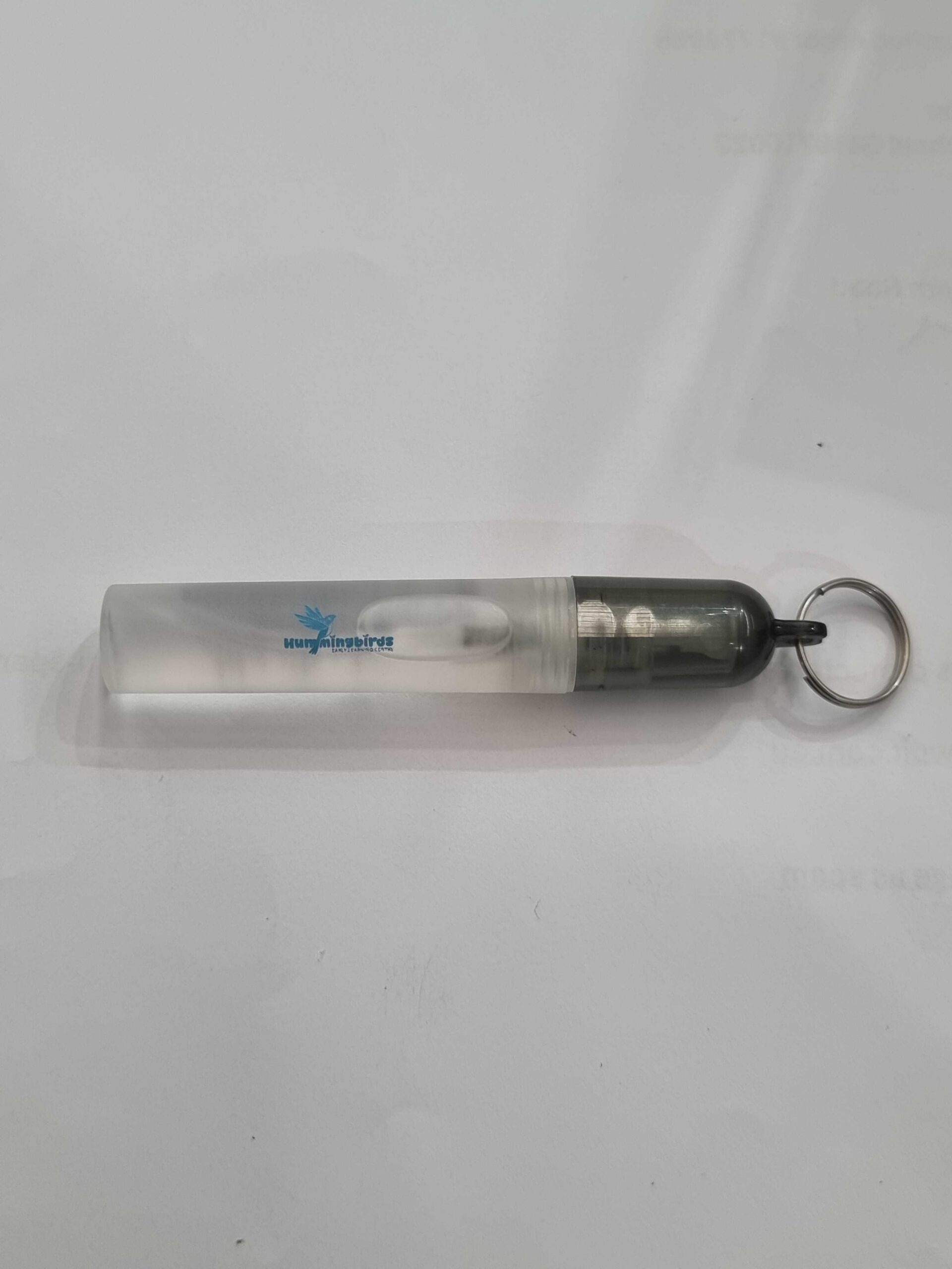 Transparent spray bottle with a keyring, custom branded with a logo.