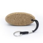 Oval cork keychain with a black cord and metal keyring on a white background.