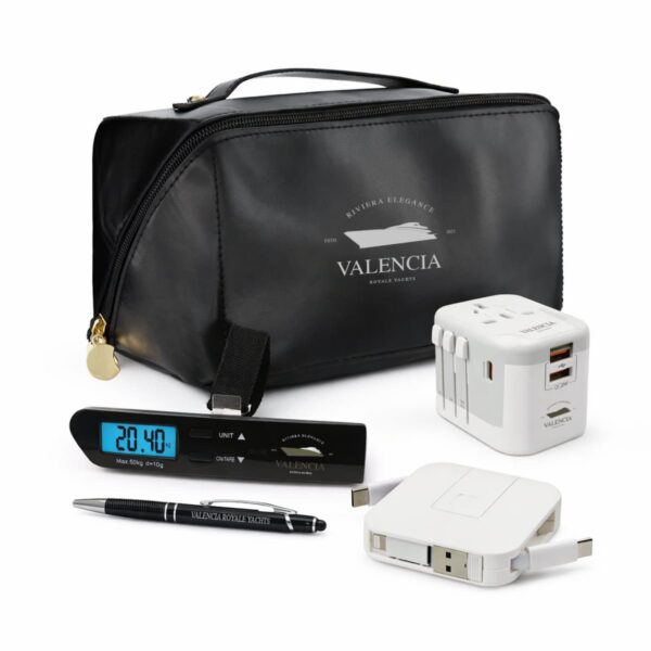 Black travel pouch with electronic accessories, pen, and digital device arranged in front.