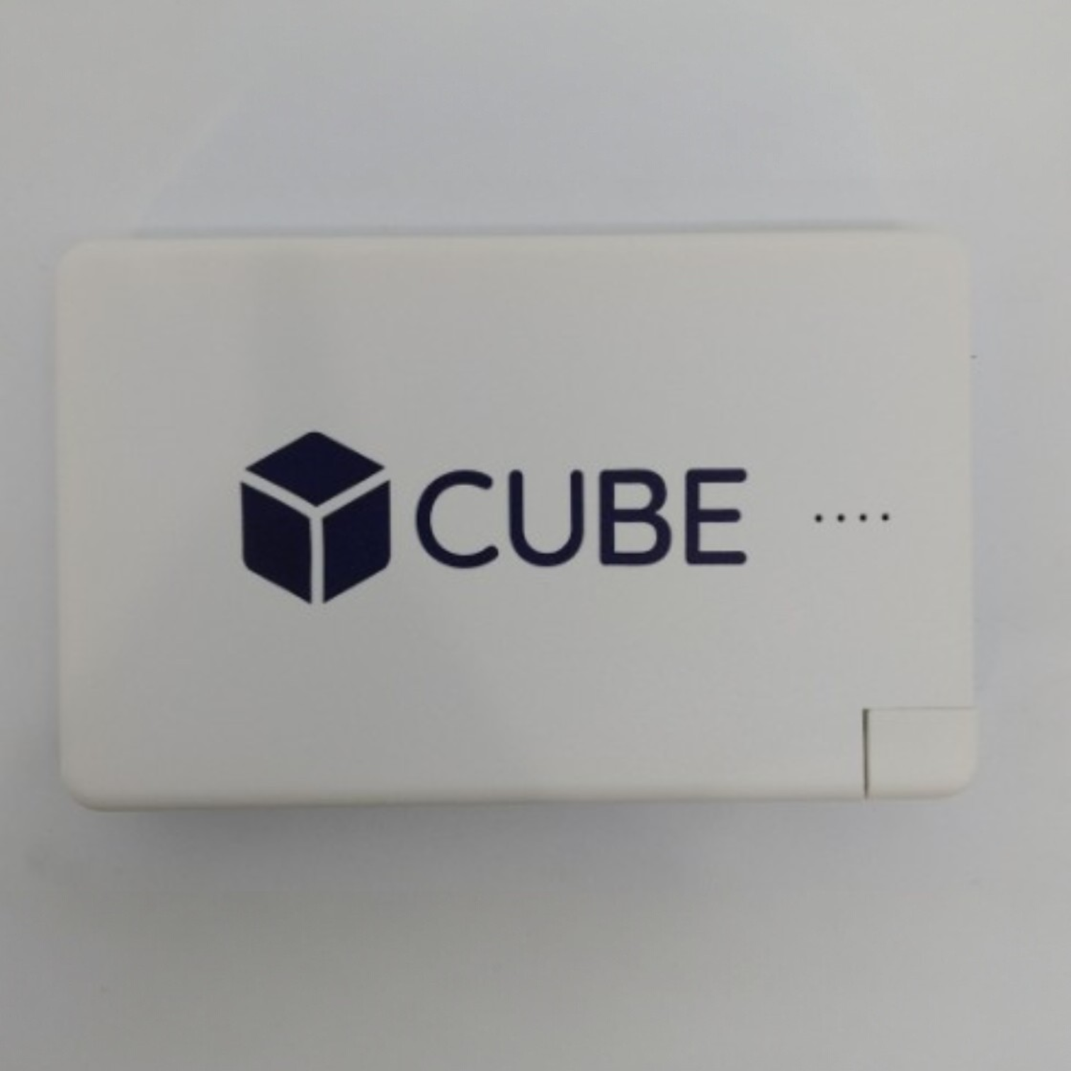 A white USB drive logo branded with a cube icon and four dots on its surface.