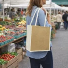Woman with Nyla Jute Tote Bags at a farmers market filled with fresh produce.