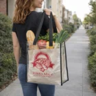 Woman carries Transparent Event Tote Bag with groceries and Terra Mall logo on a sidewalk.