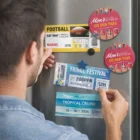 Man attaching event tickets and nail art to fridge with Circle Fridge Magnets 7Cm.