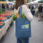 Woman at a farmers market with a Denim Look Custom Tote Bag holding lettuce and a baguette.
