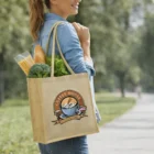 Woman carrying Mango Juco Tote Bag with groceries and Coffee House logo, outdoors.