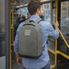 Man boards Seville bus with Seville Anti-Theft Backpack featuring Your Logo Here.