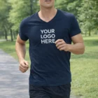 Man jogging outdoors in a navy Sol's Imperial Mens V Neck T-Shirt with "YOUR LOGO HERE" in white.