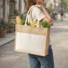 Woman with groceries in a Mumbay Cotton Pocket Jute Tote Bag 19L on a city street.
