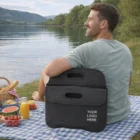 Man with Milton Stubby Cooler Bag by the lake, featuring Your Logo Here.