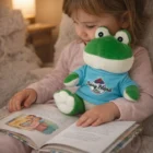 Young child hugs Frog Custom Plush Toys while reading a book on a cozy couch.