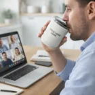 Man sipping from Camelbak Horizon Rocks Vacuum Tumbler 300ml during a laptop video call.