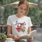 Woman reading at a café in a Sols Pioneer Womens Organic T-Shirt: simple, significant style.