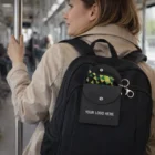 Woman with a backpack and Key Ring Pouches With Snap Closure, riding public transit.